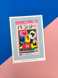 A risograph print of a small package of pansy seeds