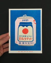 A risograph print of a japanese can of milky tea